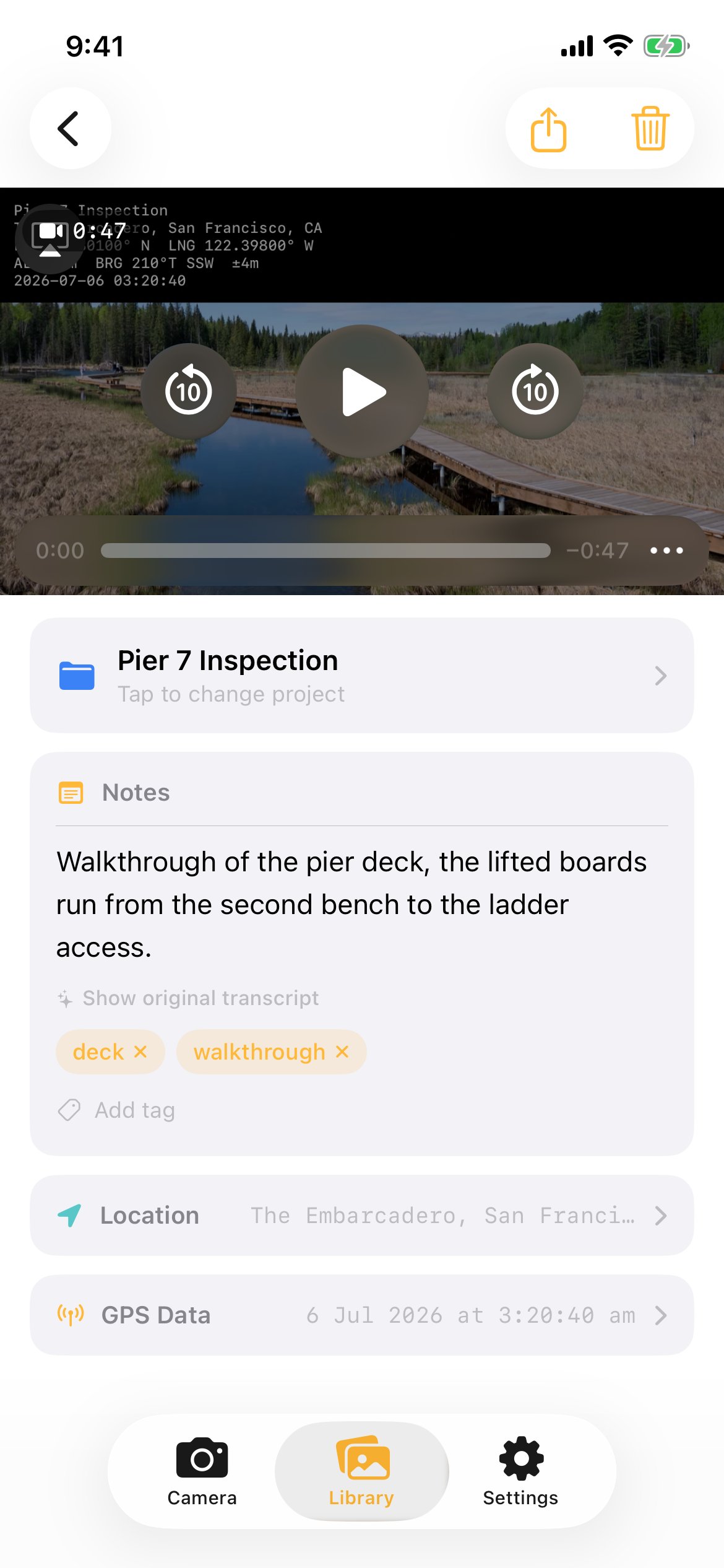Stampr video playback with the GPS stamp band burned into the footage and a transcribed walkthrough note